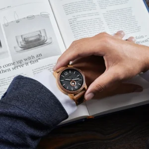 Wooden watch on wrist.