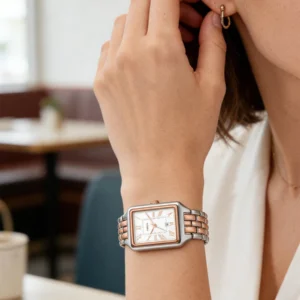 Woman's watch and earring.