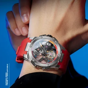 Tourbillon watch with red strap.