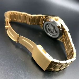 Gold metal watch bracelet detail