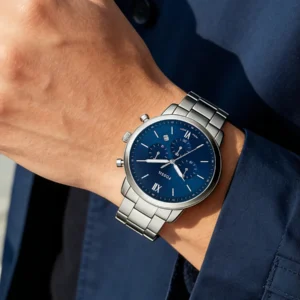 Blue dial steel watch on wrist