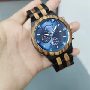 Blue wooden watch on hand