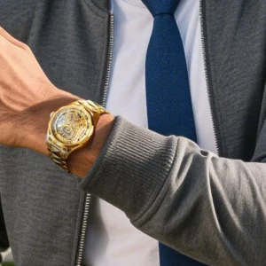 man wearing gold watch golf