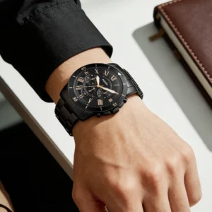 Black wrist watch on man