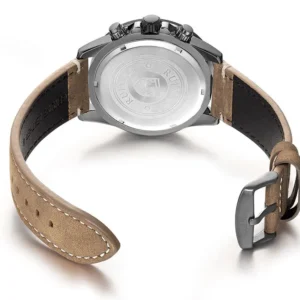 Watch with brown leather strap.
