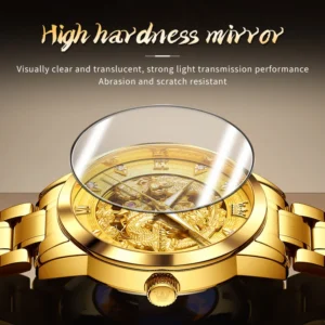 Golden watch with dragon engraving.