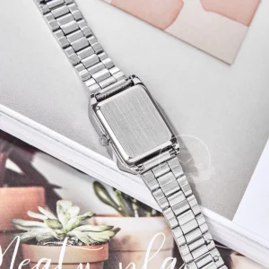 Silver watch on magazine