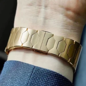 Gold geometric bracelet on wrist