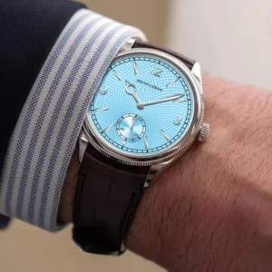 Luxury blue dial wristwatch on wrist