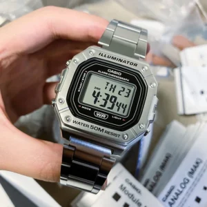 Silver digital watch on wrist.