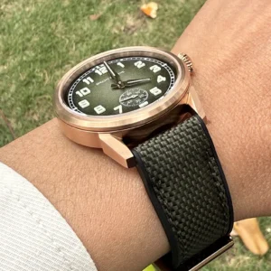 Green dial watch with strap