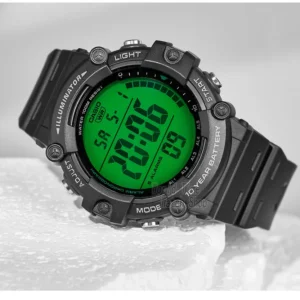 Black digital watch on white surface.