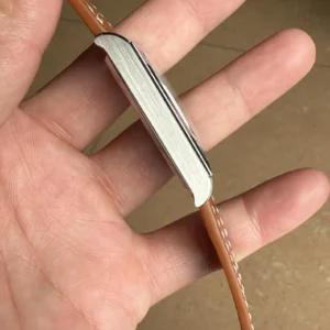 Watch held in hand.